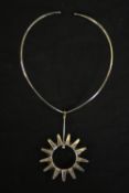 A boxed Norwegian silver collar necklace with abstract sun pendant. Hallmarked: JLM, Birmingham