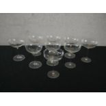 A set of nine stemmed blown glass Champagne coupes. H.15 Dia.12cm. (largest)