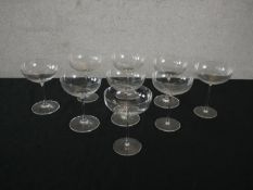A set of nine stemmed blown glass Champagne coupes. H.15 Dia.12cm. (largest)