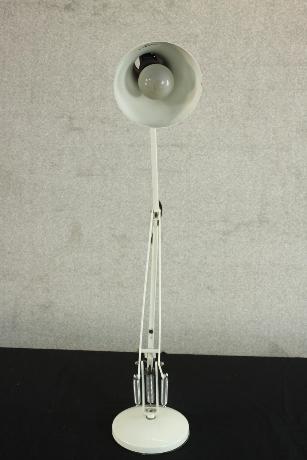 A mid 20th century Herbert Terry style anglepoise desk lamp, in white with a circular base. H.85 - Image 6 of 7