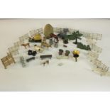 A collection of early 20th century painted lead farmyard toys, fencing, animals and other scenery.