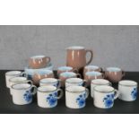 A set of ten Midwinter Stonehenge shape tea cups painted with blue flowers, together with a