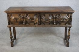 A late 19th century oak dresser base in the 17th century style, the rectangular plank top with