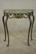 A contemporary gilt cast iron console table, of demi lune form with a plate glass top, the body