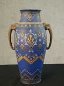 A 19th century Mettlach vase, Villeroy & Boch, slightly bulbous form with two side handles in the
