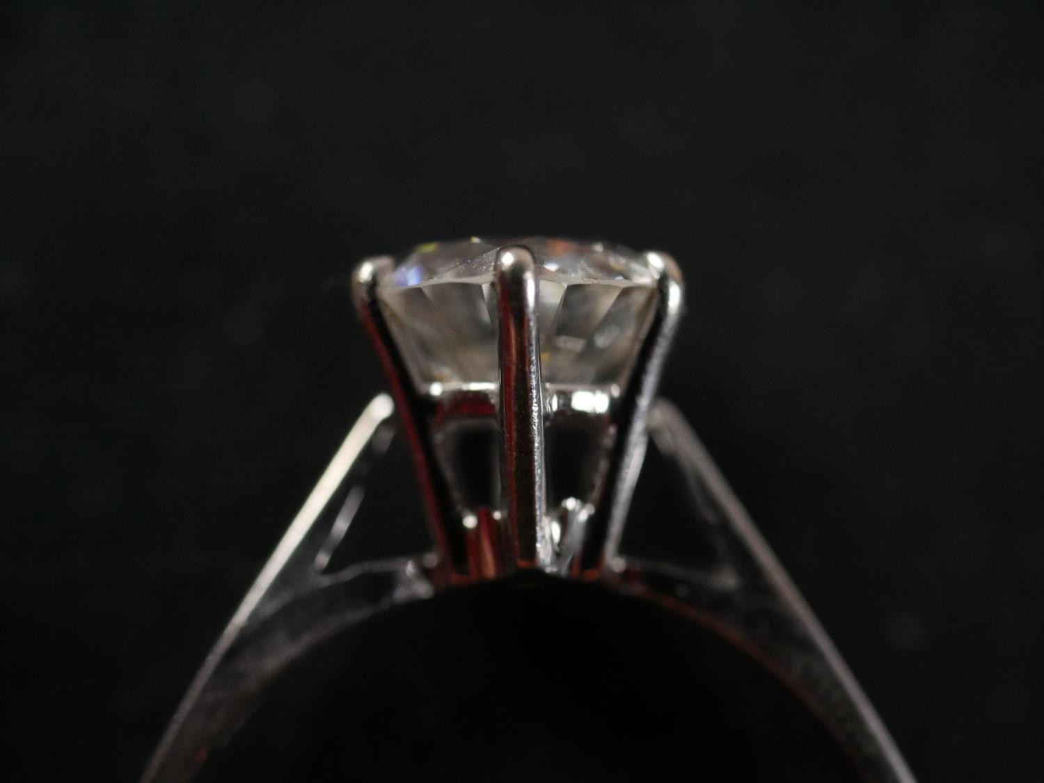 An 18 carat white gold solitaire diamond ring, set with a round old cut diamond in an open back - Image 3 of 7