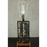 A vintage Chinese abacus table lamp on carved base, with cream fabric shade. H.55 W.18 D.12cm.