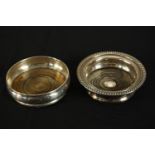 Two oak wine coasters, one silver and one silver plate. The silver one hallmarked: J B