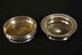 Two oak wine coasters, one silver and one silver plate. The silver one hallmarked: J B