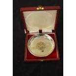 A cased Elizabeth II silver jubilee commemorative silver dish, inset with a crown coin, London,