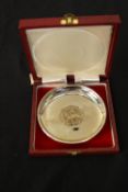 A cased Elizabeth II silver jubilee commemorative silver dish, inset with a crown coin, London,