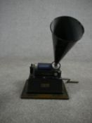 A Thomas A Edison Gem phonograph with 12cm cylinder, key and black painted tin horn. H.40 W.27 D.