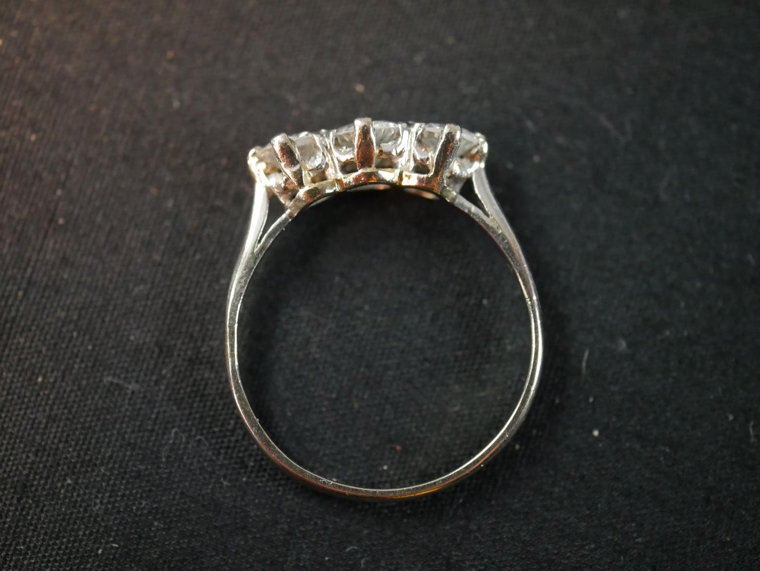 An Edwardian platinum and diamond three stone diamond ring, set to centre with a round old cut - Image 3 of 6