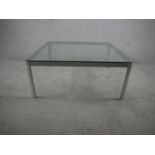 A late 20th century aluminium coffee table, of square form with canted corners with a plate glass