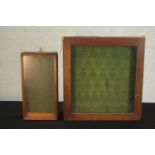 Two early 20th century wall mounted key cabinets, one with a moulded frame, both with a green lining