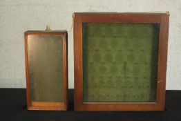 Two early 20th century wall mounted key cabinets, one with a moulded frame, both with a green lining