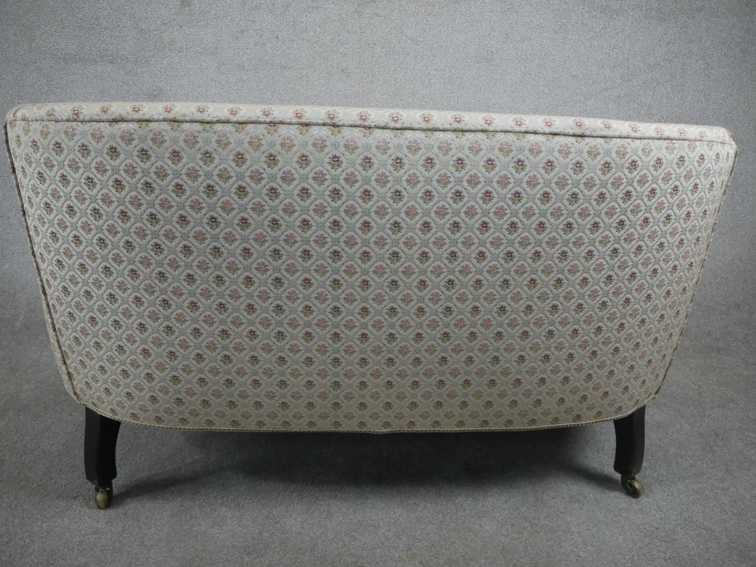 A late 19th/early 20th century two seater sofa, upholstered in patterned ivory fabric, on mahogany - Image 6 of 6