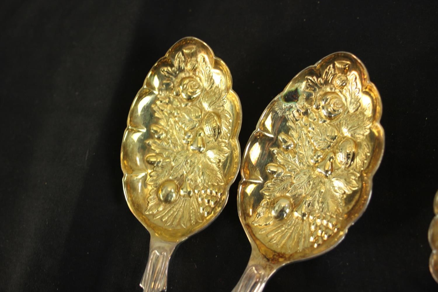 Two pairs of gilded silver plated berry spoons and a cased set of silver child's spoon and fork. ( - Image 3 of 8