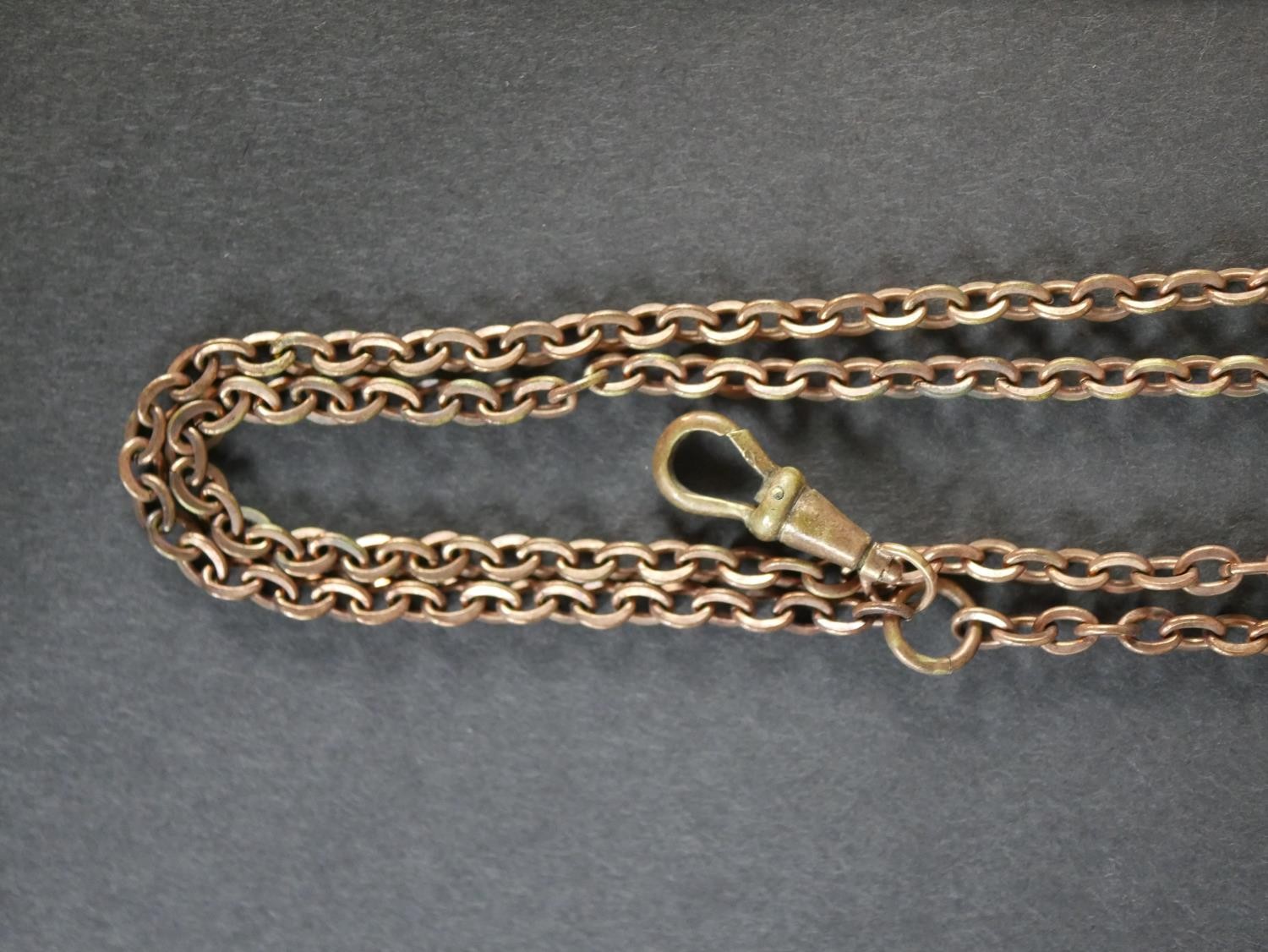 A collection of rolled Victorian chains, including two rolo link long watch chains with Albert - Image 2 of 6