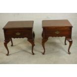 A pair of American 18th century Colonial style bedside tables fitted with brushing slide and