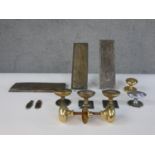 A collection of early 20th century brass and copper door decorations including a number of door