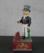 A 19th century style painted cast iron mechanical "Uncle Sam" money box, with push button action,