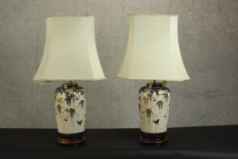 A pair of early 20th century Japanese lobed form Satsuma vases converted into table lamps, cream