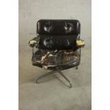 Charles & Ray Eames, an ES105 lobby chair, upholstered in dark chocolate brown leather (heavily worn