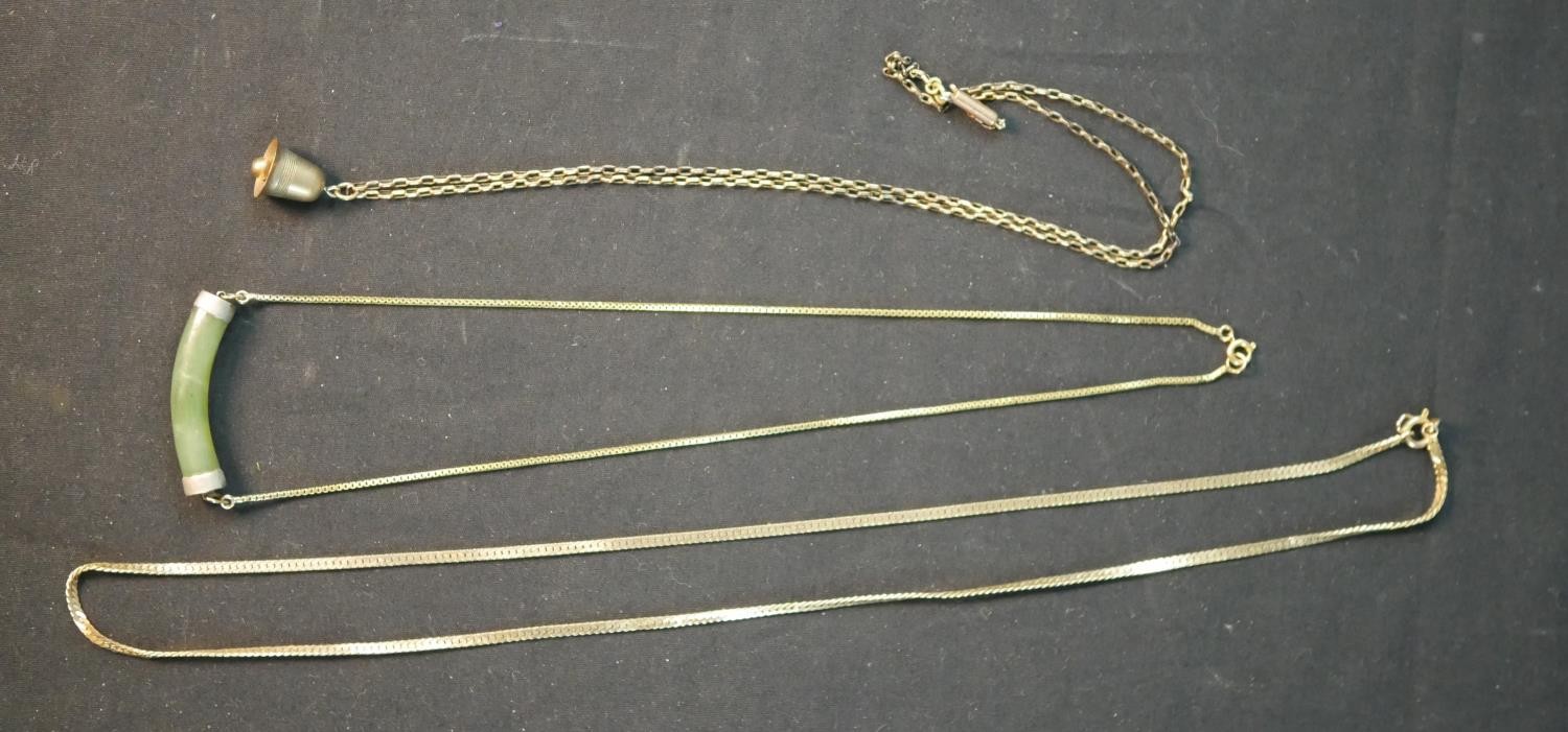 Three 9ct gold chain necklaces, including a 9ct box chain with gilded jade bar pendant, a 9ct gold