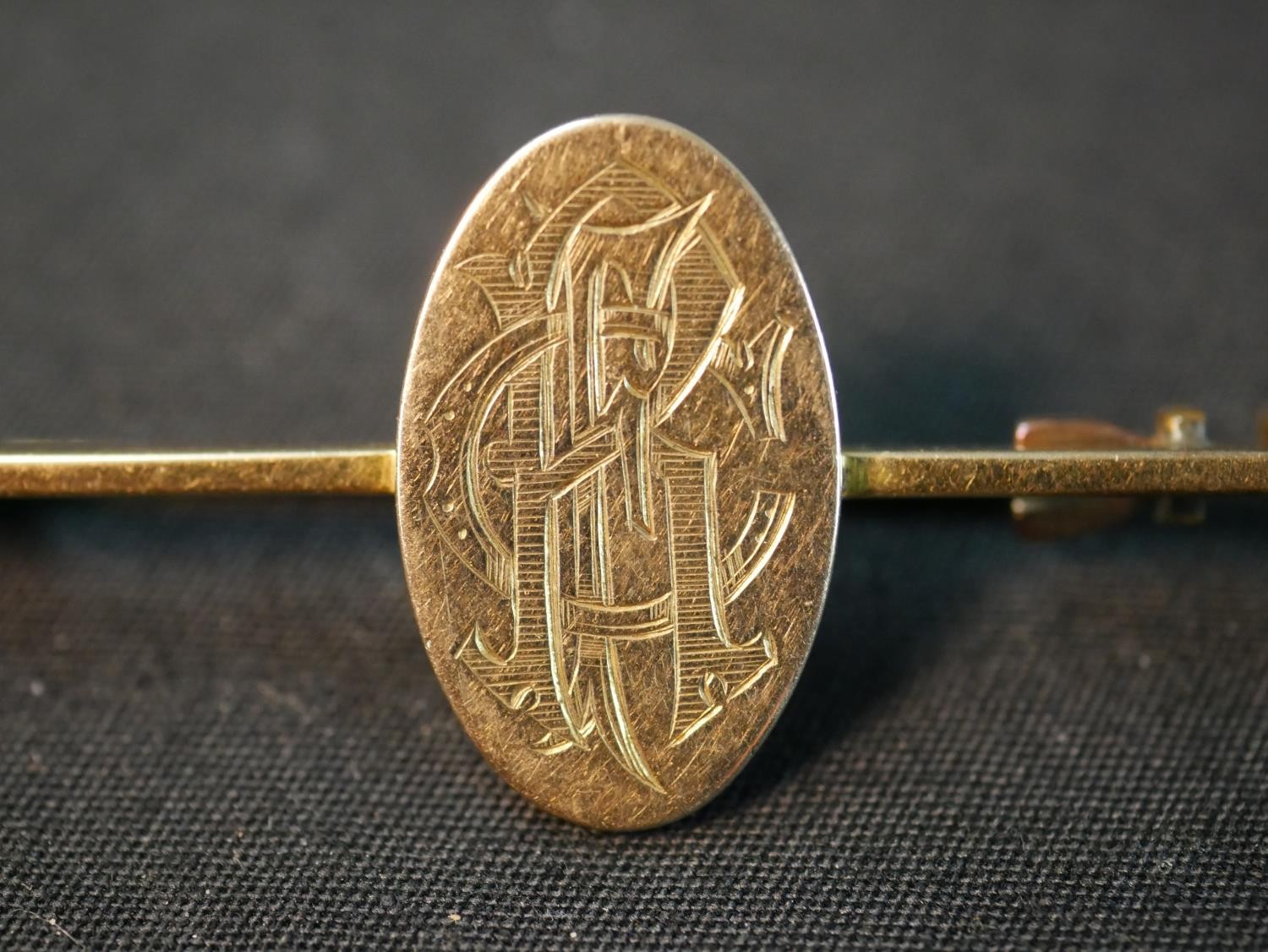 A yellow metal (tests as 9ct) engraved monogram bar brooch along with three 9ct shirt studs and a - Image 3 of 10