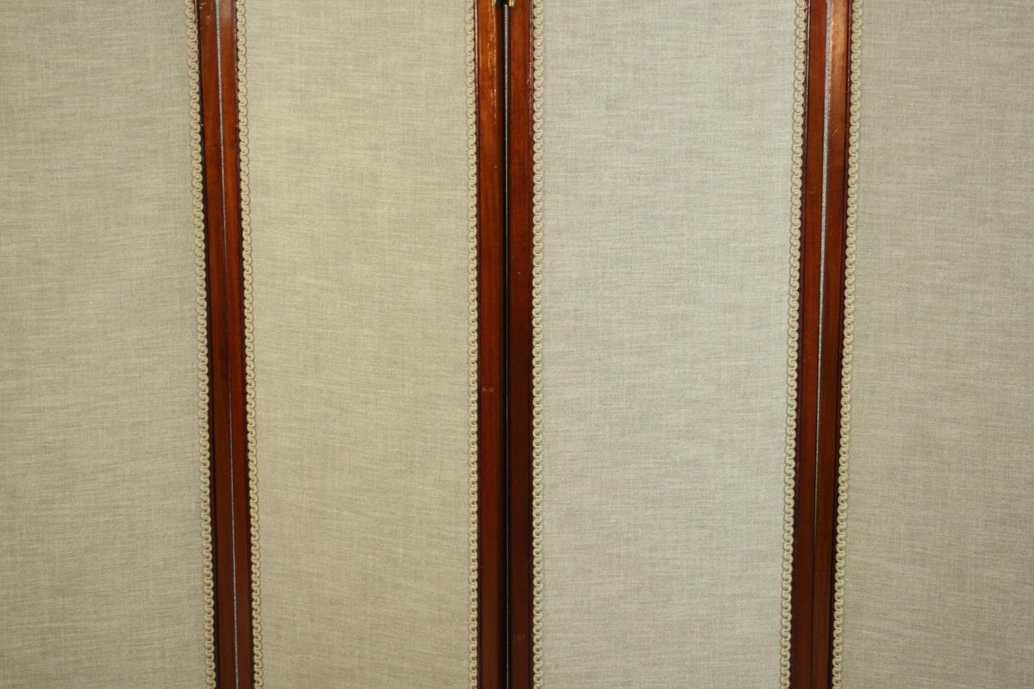 An Edwardian walnut fourfold screen, each panel upholstered with an oatmeal coloured fabric, with - Image 4 of 10