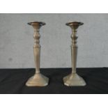 A pair of Danish Broste pewter candlesticks. Label to the base. H.28 W.10 D.10cm
