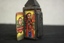 An Ethiopian African Christian portable wooden shrine with four painted panels, including St George