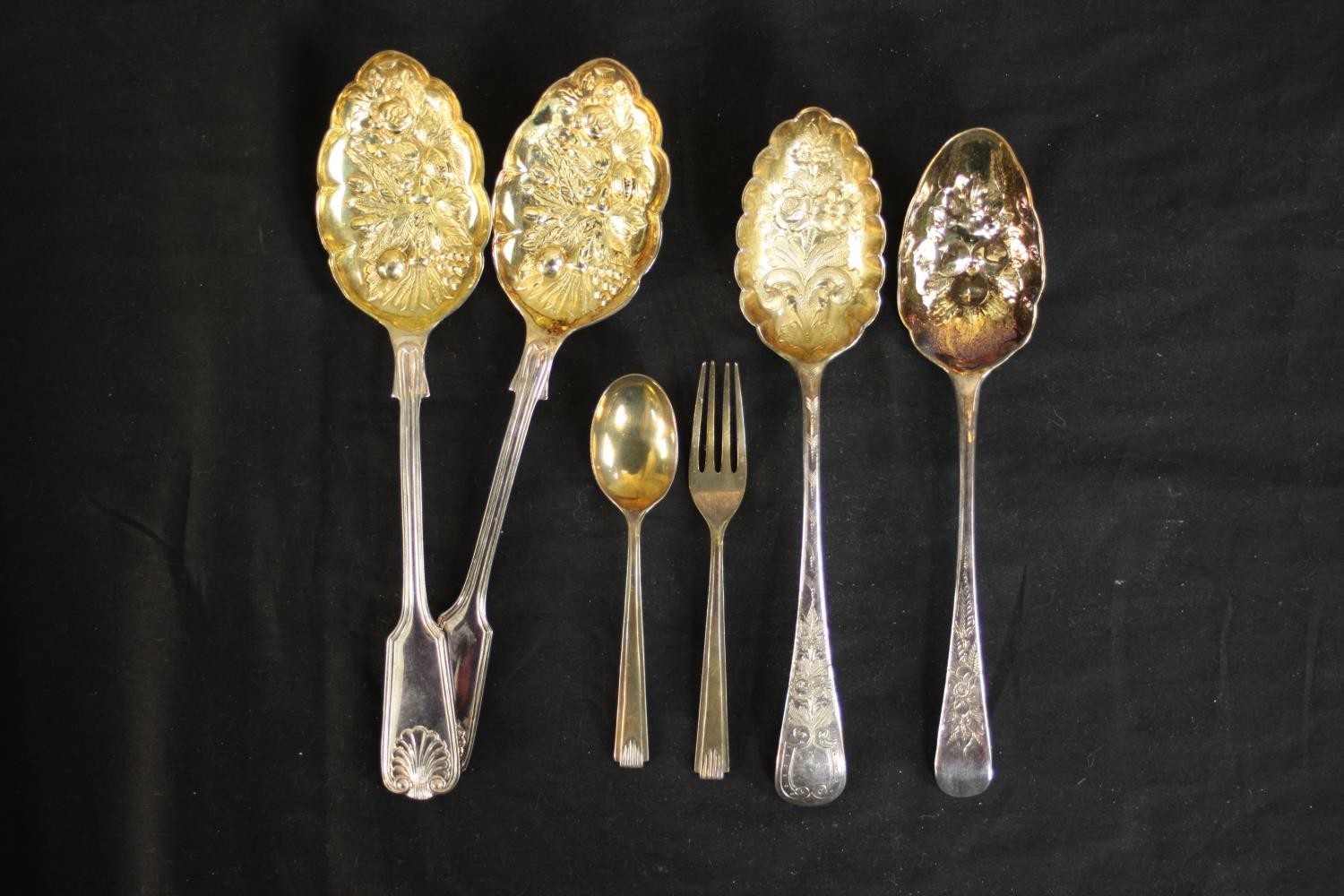 Two pairs of gilded silver plated berry spoons and a cased set of silver child's spoon and fork. ( - Image 2 of 8