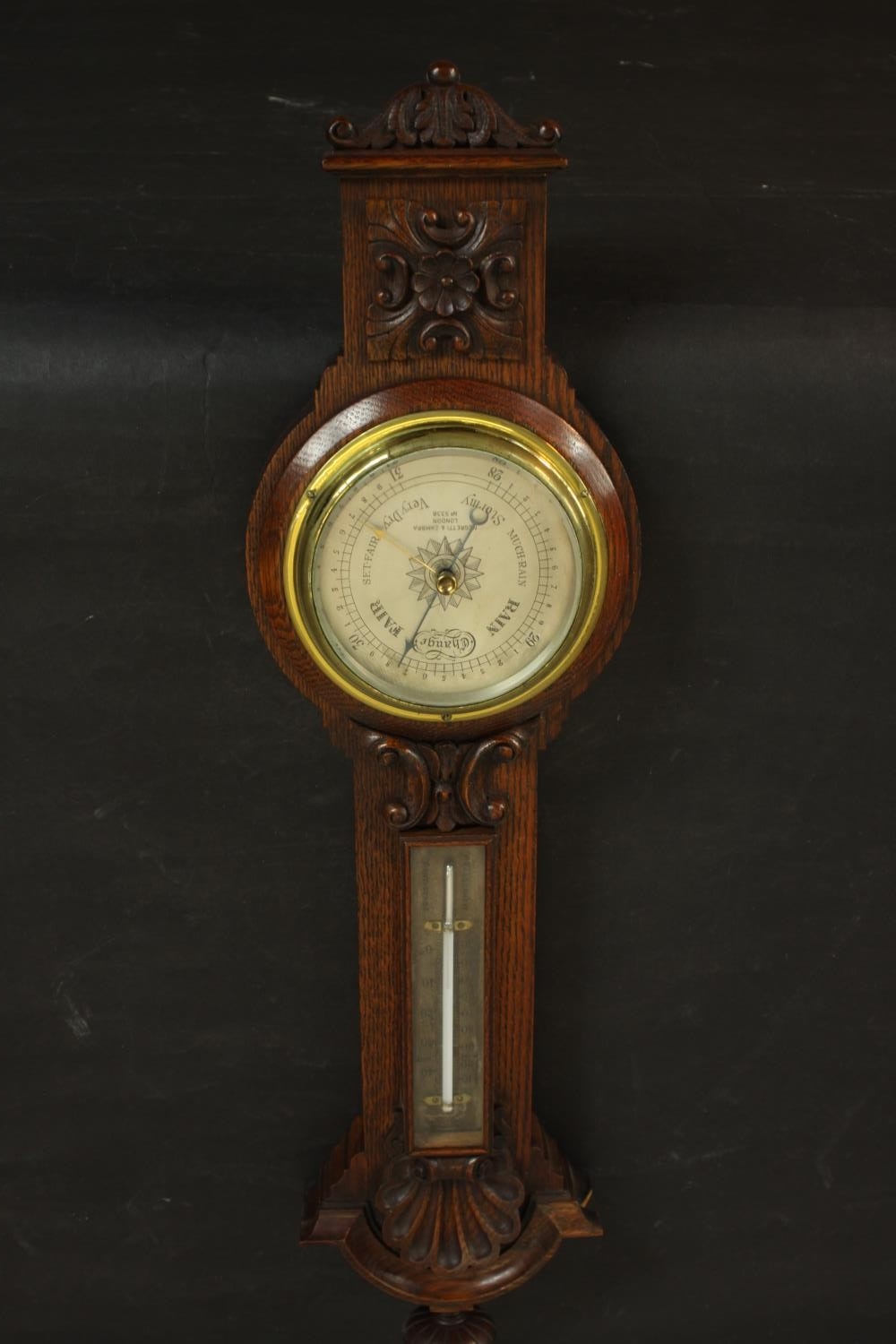 A circa 1900's Negretti & Zamba carved oak barometer and thermometer with shell and flower motifs. - Image 3 of 7