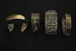 Four silver and white metal bangles (tested as silver), including a Hans Hansen abstract form torque