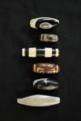 Six Tibetan agate beads, three with natural eye formations, two with circle designs and one with