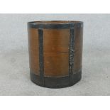 An early 20th century oak peat or coal bucket, of cylindrical form with iron banding. H.32 Diam.30.