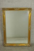 A late 20th century French style gilt framed wall mirror, with a rectangular bevelled plate. H.107