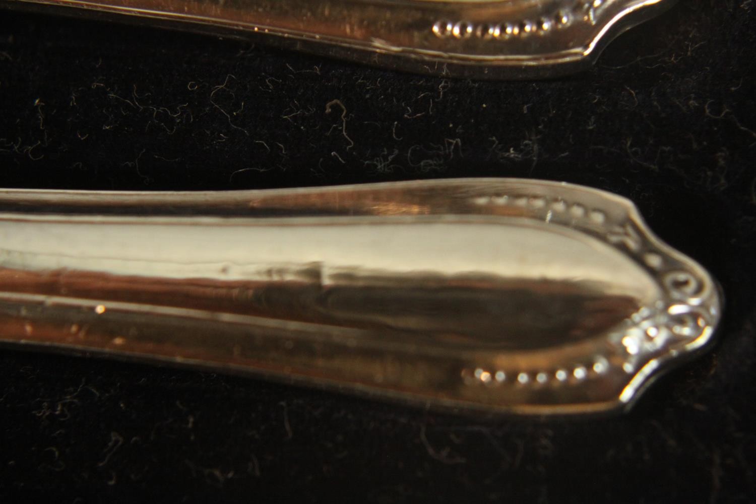 A leather cased set of coffee spoons and sugar tongs by Walker and Hall along with a cased set of - Image 8 of 9