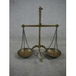 A set of 19th century brass weighing scales. H.50 W.50 D.30cm.