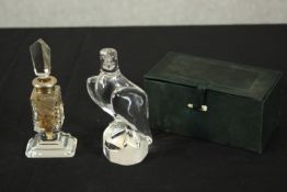 A Holmegaard crystal eagle along with a silver collared etched floral design scent bottle with