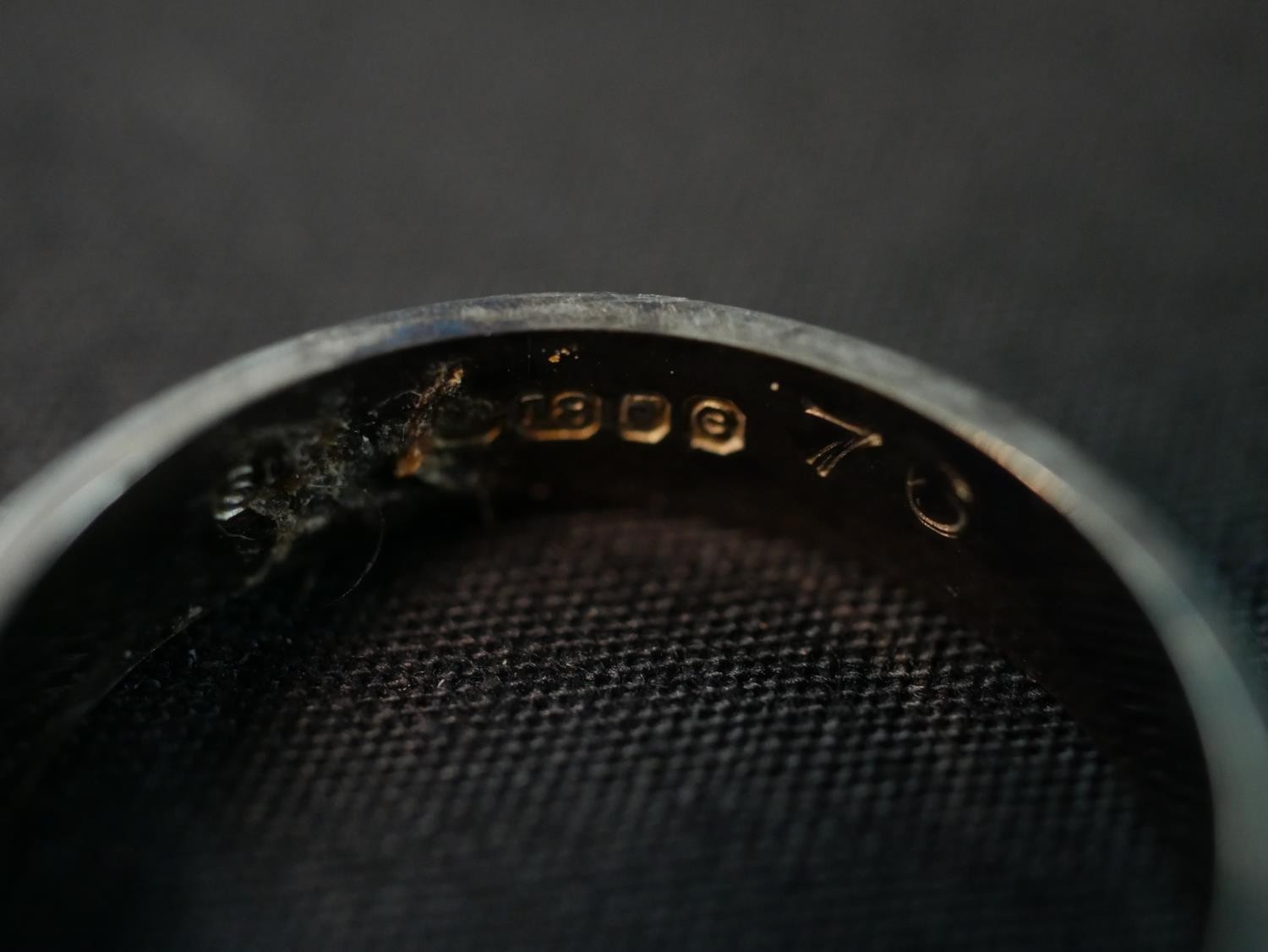 An 18ct white gold wide flat wedding band. Stamped 18, London. Weight 4.11g. Ring size O. - Image 4 of 4