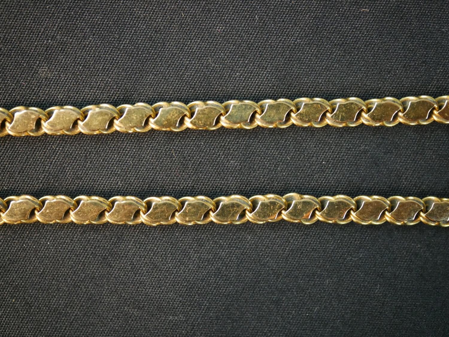 A 16 inch fancy s-link yellow metal (tests as 14ct) chain with a pair of matching earrings. The - Image 3 of 8