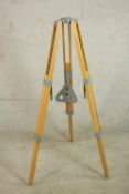 A contemporary teak adjustable tripod, with grey painted metal fittings. H.150 Dia.18cm.