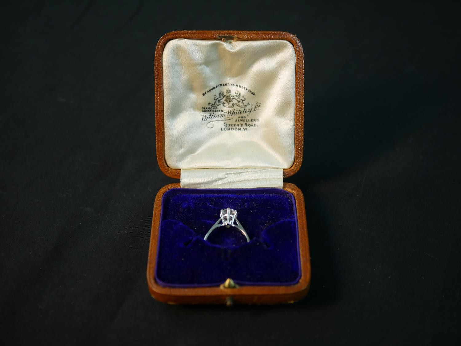 An 18 carat white gold solitaire diamond ring, set with a round old cut diamond in an open back - Image 2 of 7