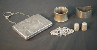 A collection of silver, including a Victorian silver cigarette case in the form of a leather bound