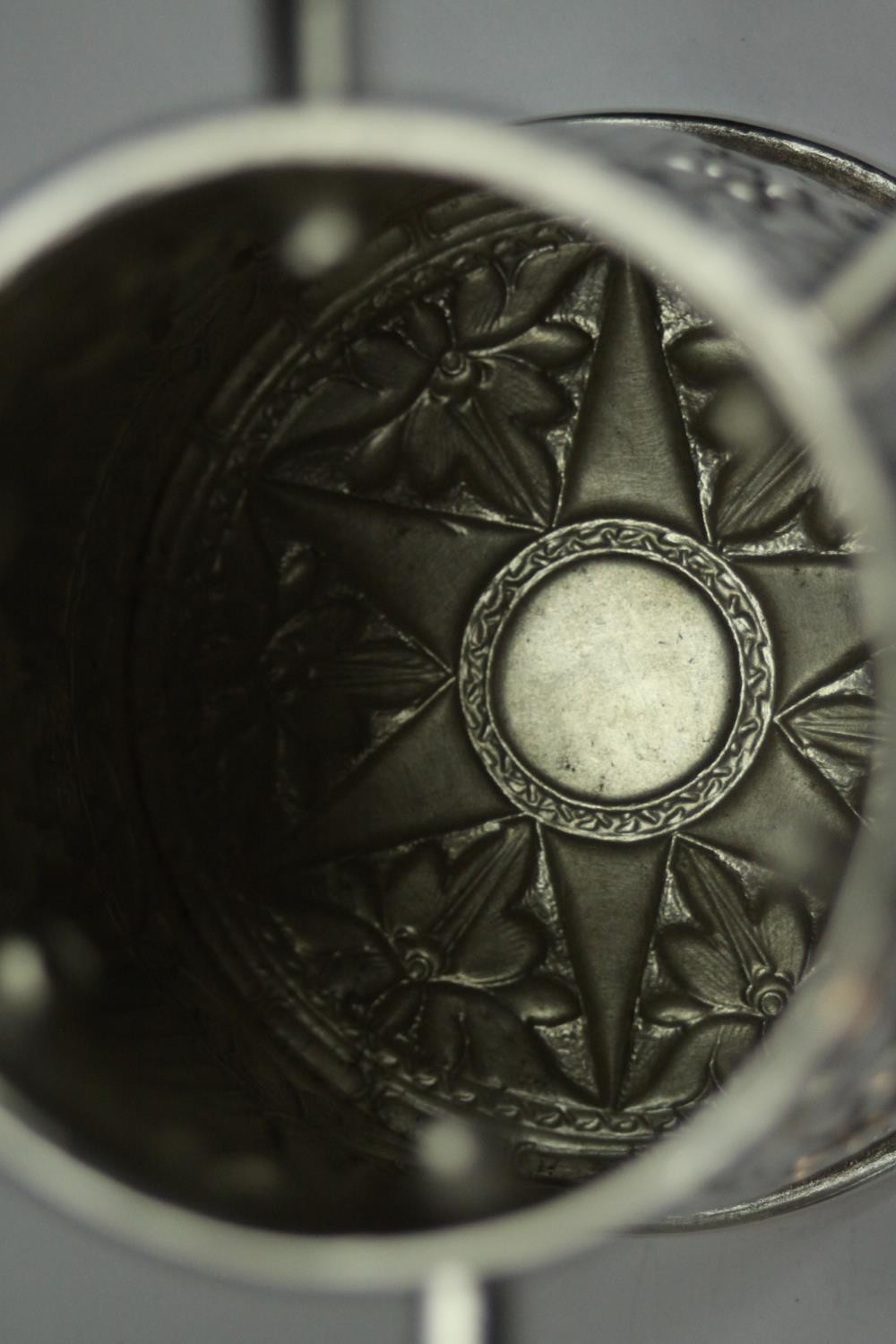 A white metal (tests as silver) repousse floral and foliate design cup with six protrusions. - Image 6 of 8