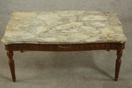 A 20th century French coffee table with a marble top, the base with gilt swag detail, on turned