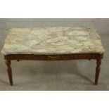 A 20th century French coffee table with a marble top, the base with gilt swag detail, on turned